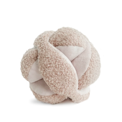 Textured knot-shaped object on a white background